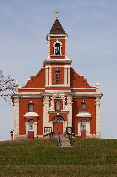 Church on the Hill.jpg - The Church of Saint Mary's is a 1909 Beaux-Arts Catholic church, located at 8433 239th Street East, New Trier in the U.S. state of Minnesota. The bright red building sits high on a hill overlooking the town, which was settled by German immigrants from Trier.